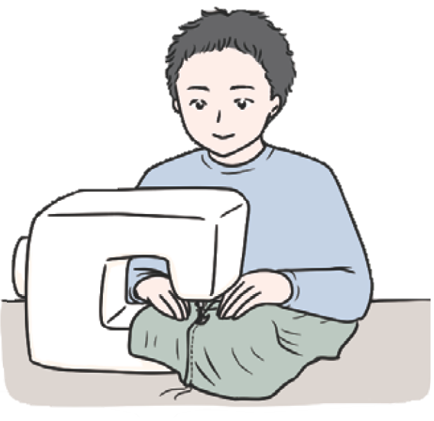 ミシンを使って製作実習に取り組む児童